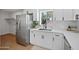 Modern kitchen featuring stainless steel appliances, white cabinets, and quartz countertops at 6335 E Brown Rd # 1065, Mesa, AZ 85205