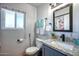 Well-lit bathroom featuring granite counters, a modern sink, and neutral paint at 7001 E Flossmoor Ave, Mesa, AZ 85208