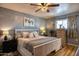 Bright bedroom with a comfortable bed, natural light, and coordinated decor, perfect for relaxation at 7001 E Flossmoor Ave, Mesa, AZ 85208