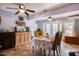 Dining room featuring neutral walls, light wood floors and an open concept at 7001 E Flossmoor Ave, Mesa, AZ 85208