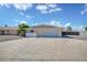 Single story home with a spacious driveway and attached two car garage at 7001 E Flossmoor Ave, Mesa, AZ 85208