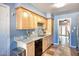 This kitchen features a stainless steel sink, updated appliances, and stylish cabinets at 7001 E Flossmoor Ave, Mesa, AZ 85208