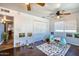 Bright playroom with wood floors, white walls and plenty of space to play at 7001 E Flossmoor Ave, Mesa, AZ 85208