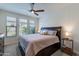 Bedroom with a wooden bed frame, carpet, and a ceiling fan at 720 E Cobble Stone Dr, Queen Creek, AZ 85140