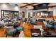 Elegant dining room with stylish seating and a large window overlooking a golf course at 720 E Cobble Stone Dr, Queen Creek, AZ 85140