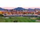 Stunning exterior view of a resort with a lush golf course and mountain views at 720 E Cobble Stone Dr, Queen Creek, AZ 85140