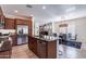 Gourmet kitchen with stainless steel appliances, granite countertops, and an island with bar stools at 720 E Cobble Stone Dr, Queen Creek, AZ 85140