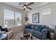 Cozy living room with a large window, comfortable seating, and stylish decor at 720 E Cobble Stone Dr, Queen Creek, AZ 85140