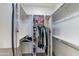 Organized walk-in closet with shelving and hanging rods provides ample storage space for clothes and accessories at 720 E Cobble Stone Dr, Queen Creek, AZ 85140