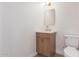 Modern bathroom featuring stylish vanity, mirror, new lighting, and fixtures at 7647 E Montecito Ave, Scottsdale, AZ 85251