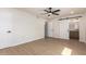 Spacious bedroom with wood flooring, barn door to bathroom and ample natural light at 7647 E Montecito Ave, Scottsdale, AZ 85251