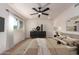 Comfortable bedroom with a neutral color palette, stylish dresser, and ample natural light at 7647 E Montecito Ave, Scottsdale, AZ 85251