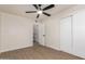 Bedroom features wood-look floors, a ceiling fan, recessed lighting and a closet at 7647 E Montecito Ave, Scottsdale, AZ 85251