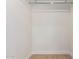 Empty closet with minimal design, and clothing rod to hang clothes and store other items at 7647 E Montecito Ave, Scottsdale, AZ 85251