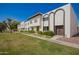 Inviting townhouse exteriors with lush green lawns and sidewalks for comfortable living at 7647 E Montecito Ave, Scottsdale, AZ 85251