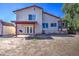 The home features an expansive backyard with an outdoor patio and plenty of room for recreation at 7844 W Jenan Dr, Peoria, AZ 85345