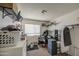 Cluttered bedroom with neutral walls, carpet flooring, and a large window for natural light at 7844 W Jenan Dr, Peoria, AZ 85345