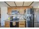 Well-equipped kitchen featuring stainless steel appliances and granite countertops at 7844 W Jenan Dr, Peoria, AZ 85345