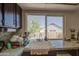 Kitchen sink with a view of the backyard and granite countertops at 7844 W Jenan Dr, Peoria, AZ 85345