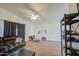 Spacious living room with lots of floor space, a ceiling fan, and ample natural light at 7844 W Jenan Dr, Peoria, AZ 85345