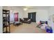 Bright living room featuring a ceiling fan, lots of space, and natural light at 7844 W Jenan Dr, Peoria, AZ 85345