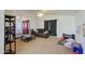 Bright living room featuring a ceiling fan, lots of space, and natural light at 7844 W Jenan Dr, Peoria, AZ 85345