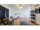 Bright living room with lots of floor space, large windows, and ceiling fan at 7844 W Jenan Dr, Peoria, AZ 85345