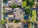 Aerial view showcasing a property's layout, including the pool, patio, and well-manicured landscaping at 834 W Whitten St, Chandler, AZ 85225