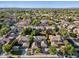 Wide aerial view of the neighborhood showcasing its neat rows of homes and the distant mountains at 834 W Whitten St, Chandler, AZ 85225