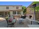 Backyard with outdoor fireplace and kitchen area with comfortable seating at 834 W Whitten St, Chandler, AZ 85225