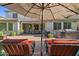 Outdoor patio area with comfortable seating, outdoor kitchen, and brick pavers at 834 W Whitten St, Chandler, AZ 85225