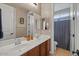 Bright bathroom with double sinks, a large mirror, and a shower with a modern curtain at 834 W Whitten St, Chandler, AZ 85225