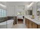 Elegant bathroom with a soaking tub, double sinks, and stylish fixtures at 834 W Whitten St, Chandler, AZ 85225