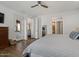 Spacious bedroom featuring wood floors, a walk-out to a patio, and a large bed at 834 W Whitten St, Chandler, AZ 85225