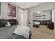 Charming bedroom featuring neutral colors, carpet, a mirrored closet, and a creative decor at 834 W Whitten St, Chandler, AZ 85225