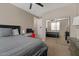 Cozy bedroom featuring neutral walls, carpet, and a mirrored closet reflecting a similar style at 834 W Whitten St, Chandler, AZ 85225