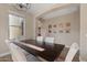 Formal dining area with a wooden table, neutral decor, and lots of natural light at 834 W Whitten St, Chandler, AZ 85225