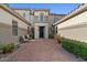 Stunning courtyard showcasing a welcoming entrance, lush greenery, and seating area at 834 W Whitten St, Chandler, AZ 85225