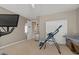 Bright exercise room featuring a ceiling fan, window, and various workout machines at 834 W Whitten St, Chandler, AZ 85225