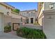 Charming home with a private courtyard, a gate, lush landscaping, and an elegant front entrance at 834 W Whitten St, Chandler, AZ 85225