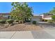 Charming home featuring desert landscaping, a well-manicured yard, and an attached two-car garage at 834 W Whitten St, Chandler, AZ 85225