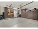Well-organized garage with ample storage cabinets, a sink, and epoxy flooring at 834 W Whitten St, Chandler, AZ 85225