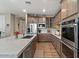 Gourmet kitchen with granite counters, stainless steel appliances, and custom cabinetry at 834 W Whitten St, Chandler, AZ 85225