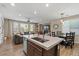 Open-concept kitchen offering a breakfast bar, an adjacent living area, and stainless appliances at 834 W Whitten St, Chandler, AZ 85225