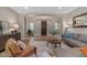 Comfortable living room features a modern sofa, stylish furnishings, and neutral paint tones at 834 W Whitten St, Chandler, AZ 85225