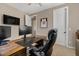 Functional office space featuring modern furniture, a wooden desk and natural lighting at 834 W Whitten St, Chandler, AZ 85225