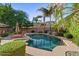 Backyard with swimming pool, lounge chairs, lush landscaping, and privacy fence at 834 W Whitten St, Chandler, AZ 85225