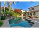 Backyard pool with rock features, water and lush landscaping at 834 W Whitten St, Chandler, AZ 85225