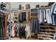 Organized walk-in closet with ample storage, shelving, and racks for clothes and accessories at 834 W Whitten St, Chandler, AZ 85225