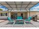 Outdoor patio area with shaded pergola, comfortable outdoor seating, and grill at 855 S Revolta Cir, Mesa, AZ 85208